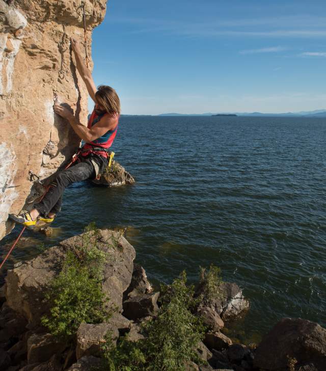 woman climbing Lone Rock