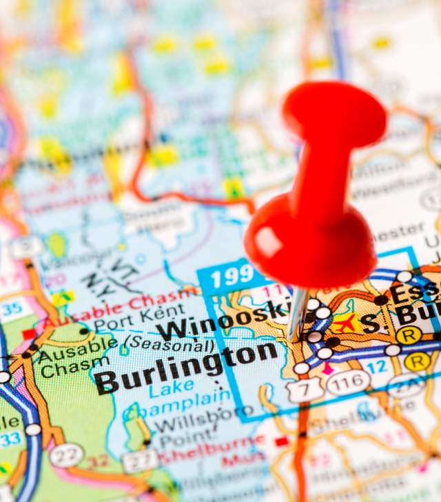 red push pin marking Burlington Vermont on a map