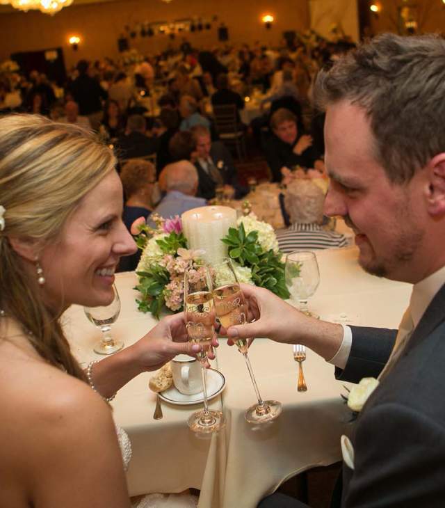 Newly wed couple toasting