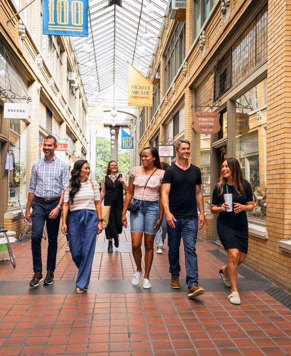 Group of professionals walking through Nickels Arcade