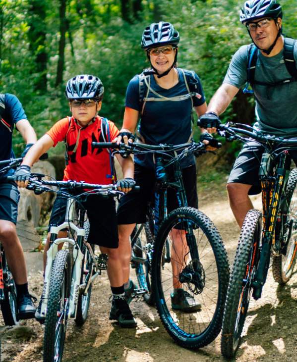 Family of four on mountain bikes