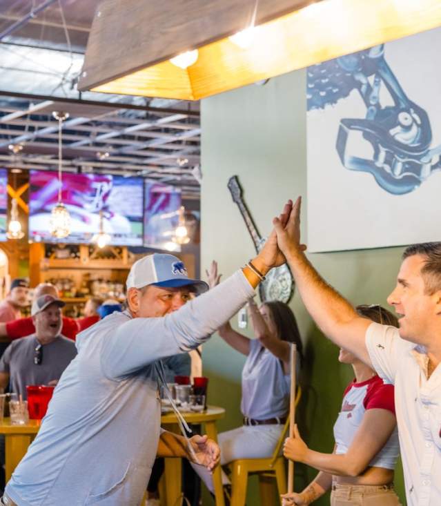 Friends at Pedalers Pub High Five