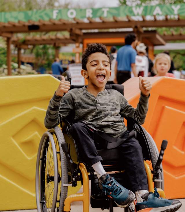 Boy in wheelchair enjoying the zoo