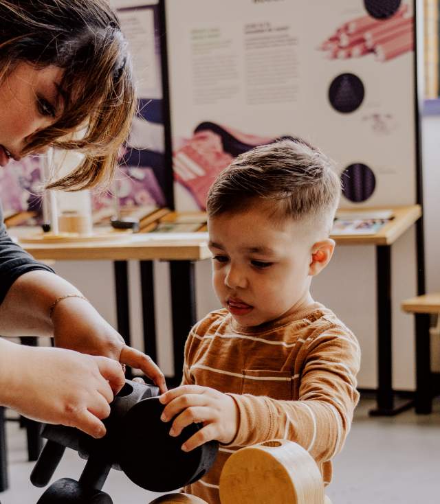 Mother and son doing a science experiment at Science Central