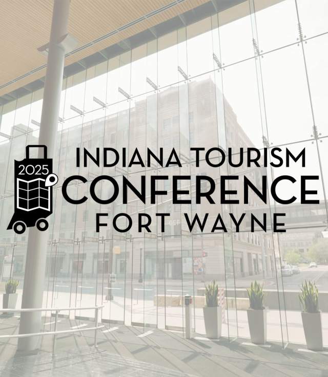 Grand Wayne Center pre conference space with glass walls and the 2025 Indiana Tourism Conference Fort Wayne logo