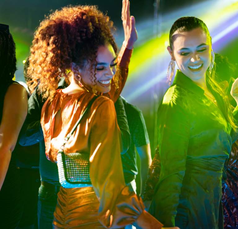 Clubgoers dancing inside nightclub