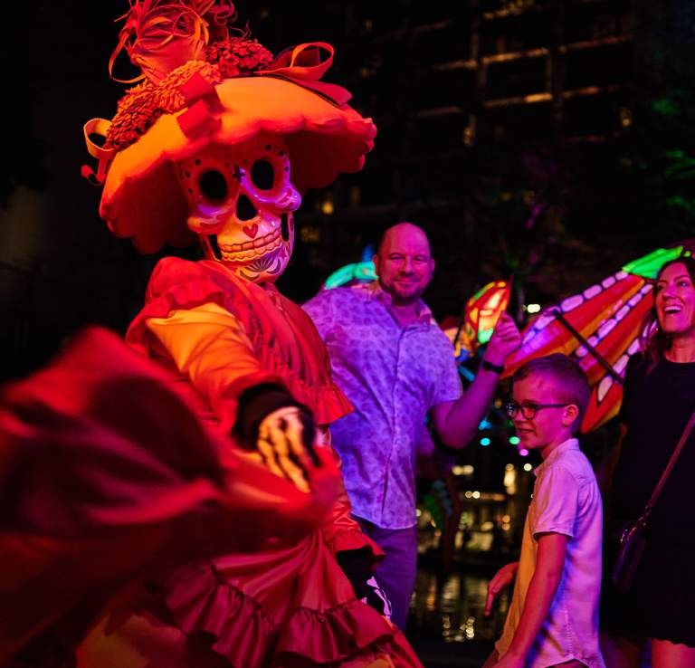 Family dressing with woman dressed in sugar skull attire