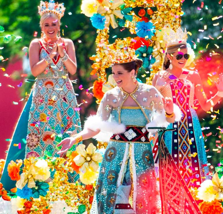 Girls on parade float surrounded by confetti