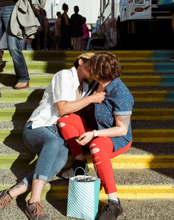 couple kissing on steps