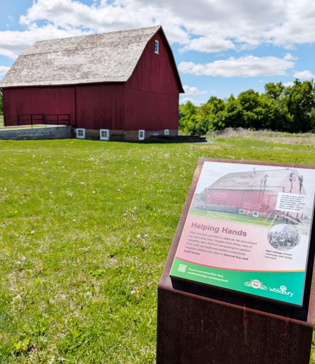 Historic red barn with self-guided tour signage