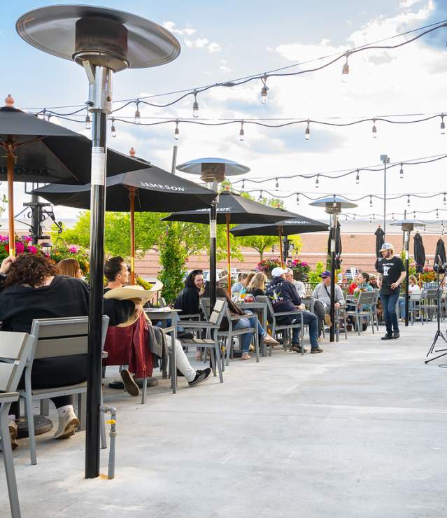 Tamarack Tap Room patio with live music playing to diners.