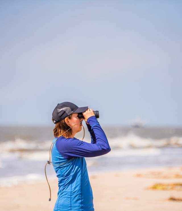Birder at Rutherford Beach Creole Nature Trail