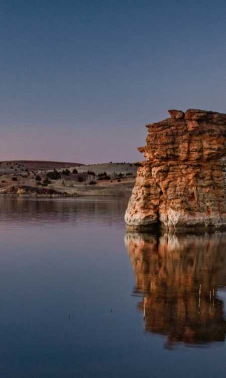 Calm waters of Wilson Lake and rock formations in Kansas