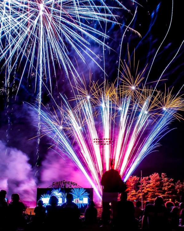 A fireworks display lights up the darkened sky above FirstEnergy Stadium.