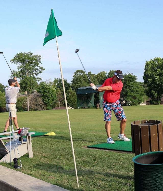 Golfers teeing off