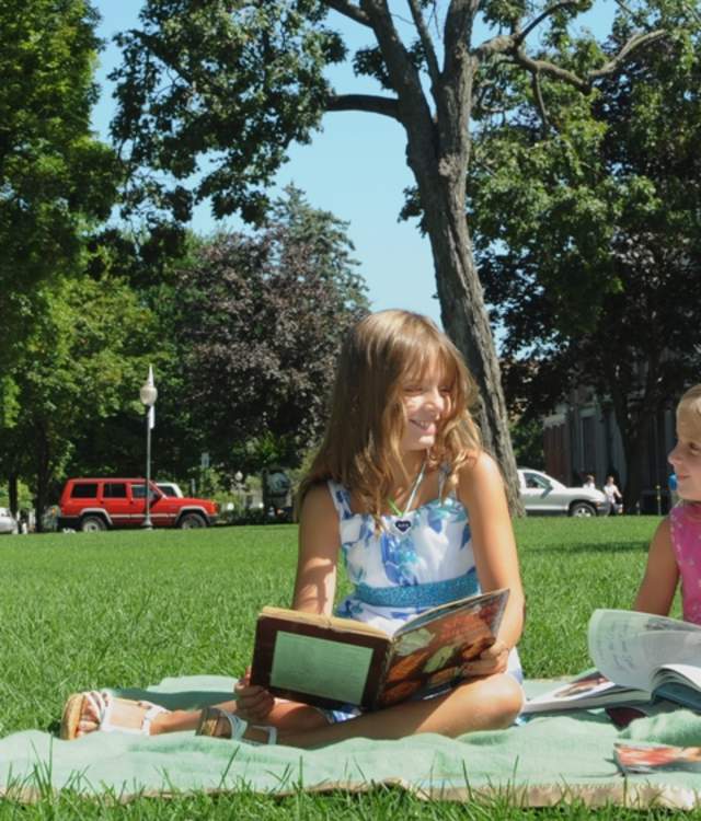 people reading and chatting outside the canfield casino