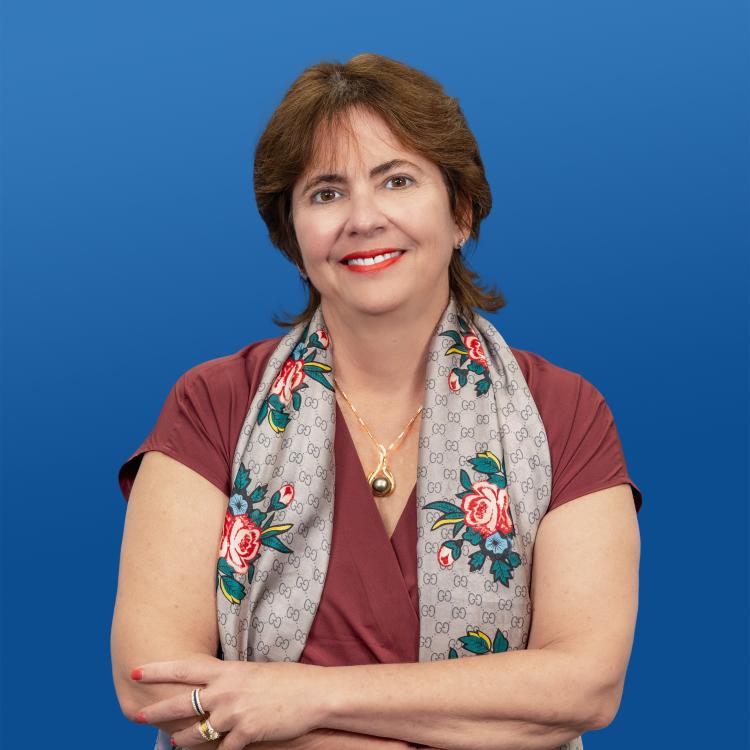 Headshot of Visit Orlando Board Member Claudia Menezes