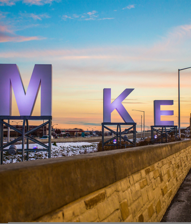 giant letters spelling M K E outside of Milwaukee airport