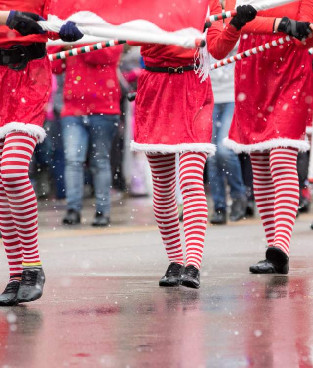 Close up of elves walking in the Christmas Parade