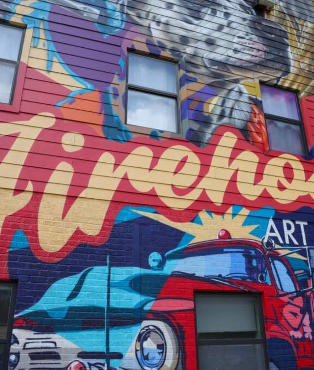 The front of the colorful Firehouse Art Center mural