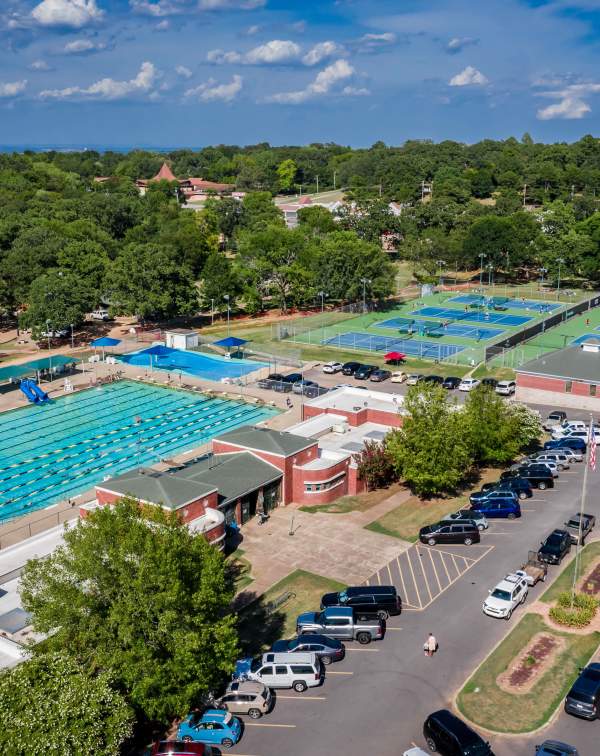 Creekmore Park boasts a tennis center and pool for sports use.