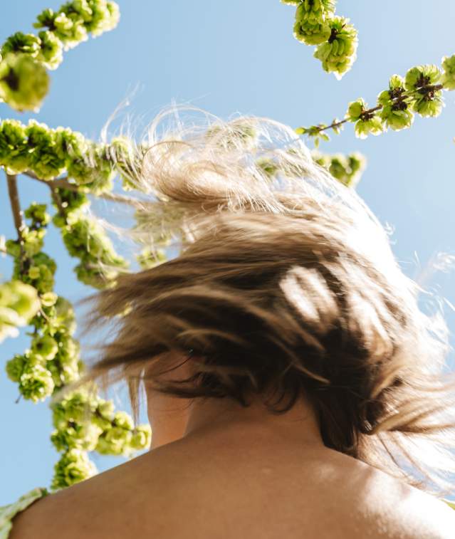 spring woman flipping hair