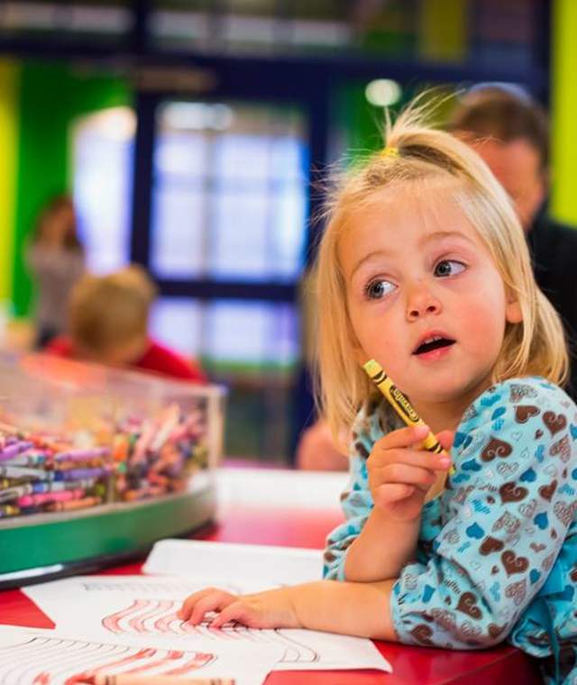 Child Drawing At The Crayola Experience