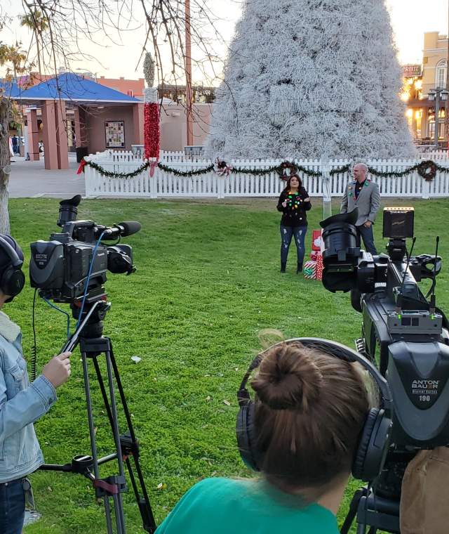 Video production crew in front of Chandler Tumbleweed Tree