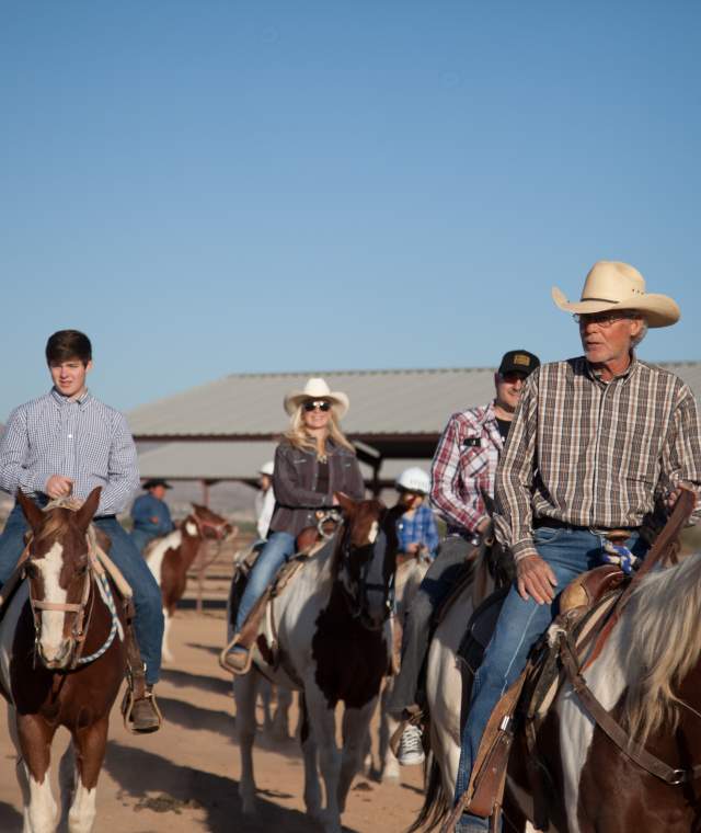 Group Of People Horseback Riding At Koli Equestrian Center In Chandler, AZ