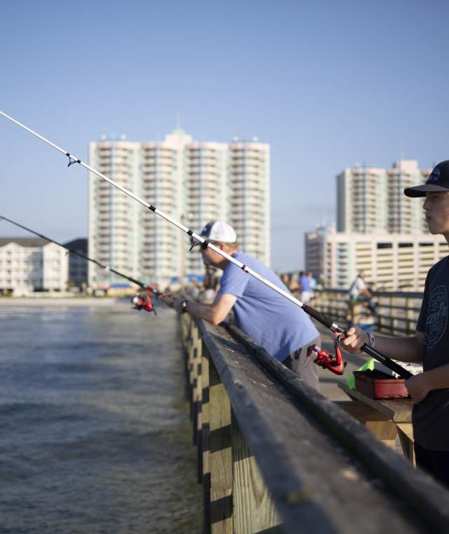 Fishermen cast a line over the side of the Cherry Grove Pier in North Myrtle Beach.