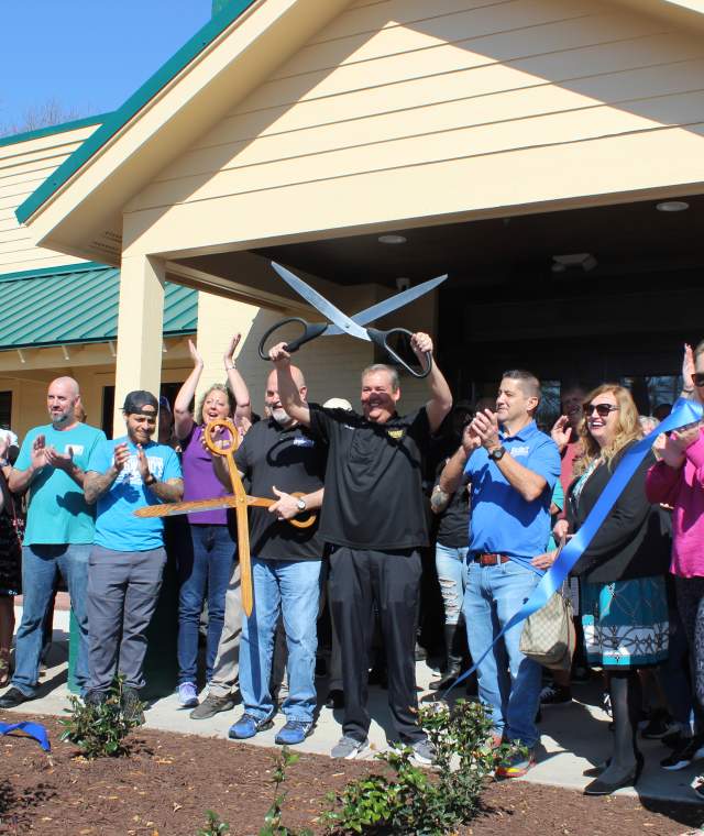 Picture of the ribbon cutting event at Dagwood's Deli