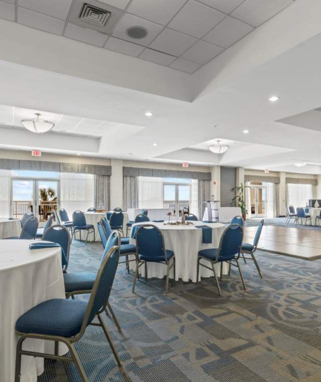 Baywatch Meeting Room with tables, chairs, and a dancefloor
