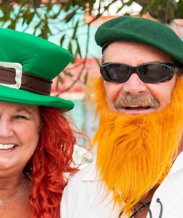 Two people dressed in St. Patrick's day garb