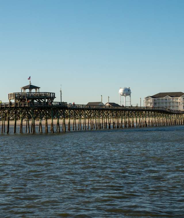 The Cherry Grove pier from the water looking back at the shore and Prince Resort