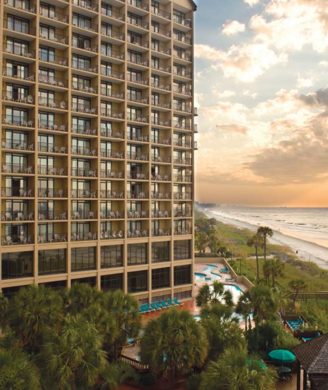 an oceanfront beach resort at dusk
