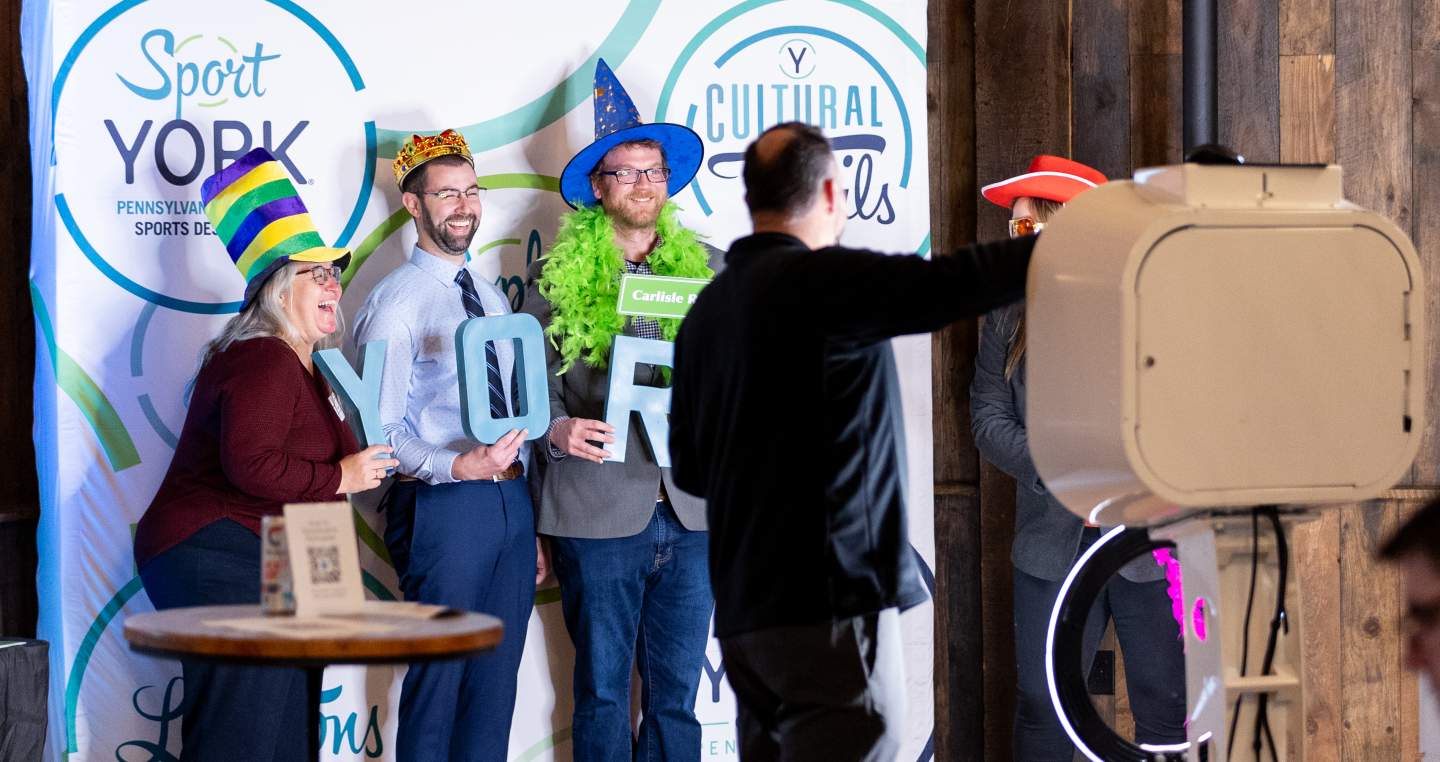 Explore York members enjoying the photobooth at the 21st annual tourism industry event