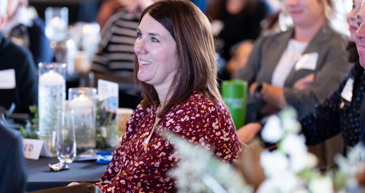 explore york member smiling at our annual atie event