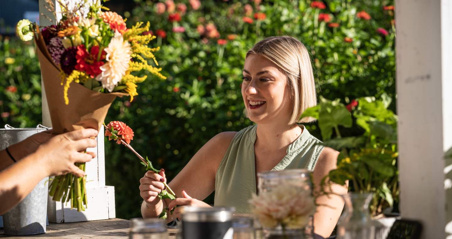 a customer purchasing beautiful flowers at Terra Farms