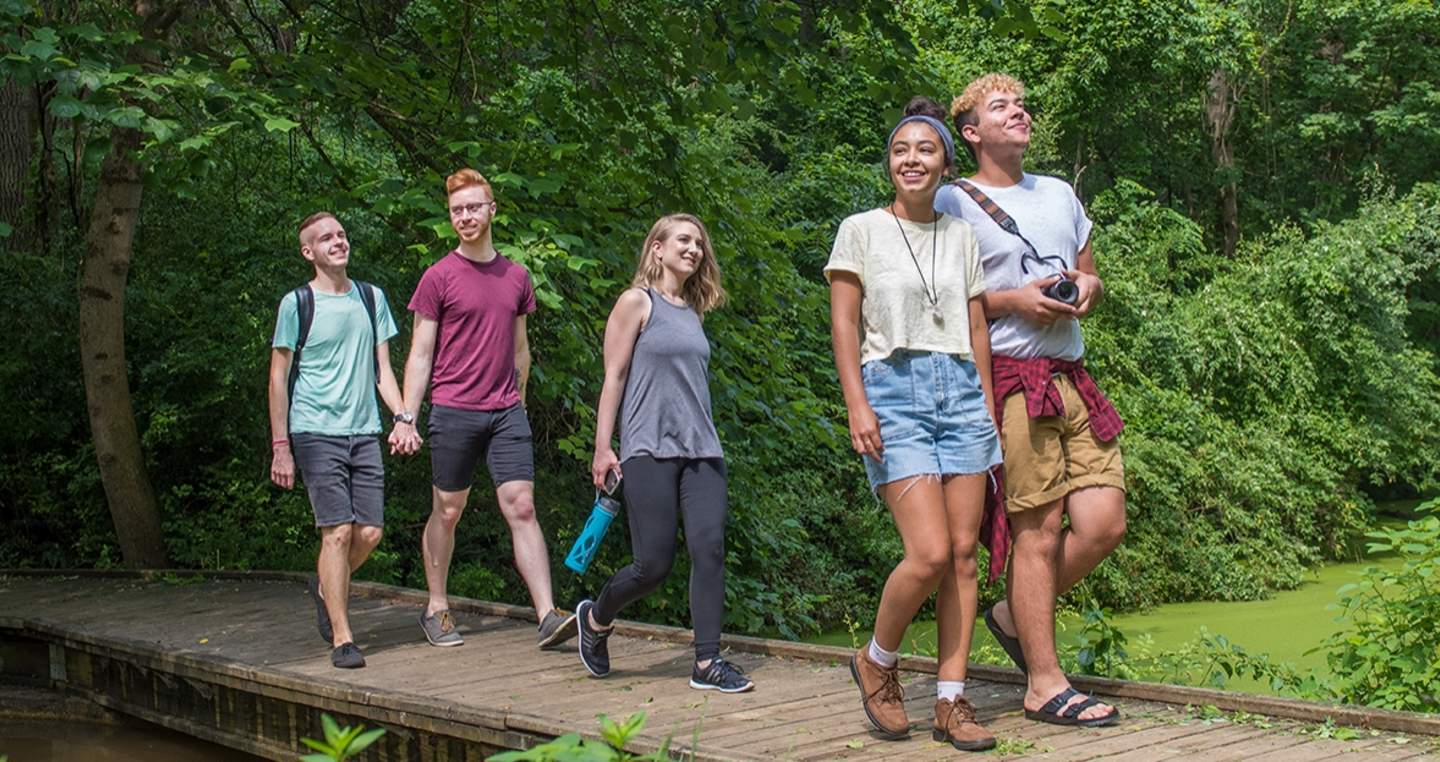Friends & Couples Walking Across Small Wooden Bridge at Nixon Park