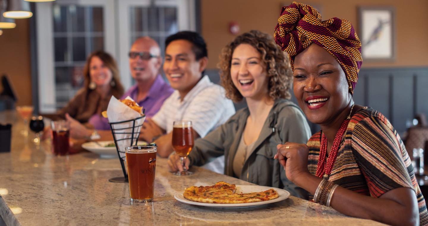 Group Laughing at Bar