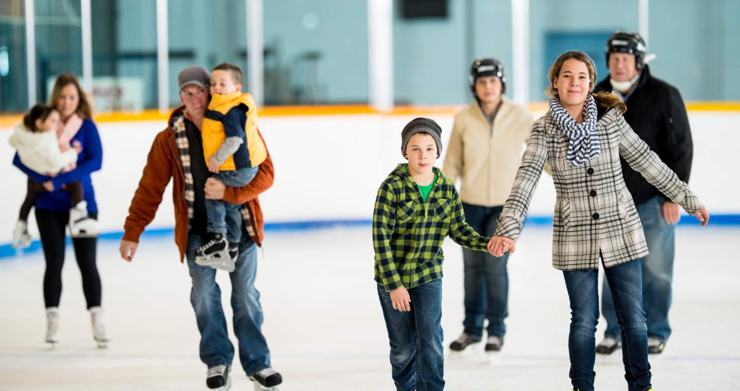 people happily ice skating