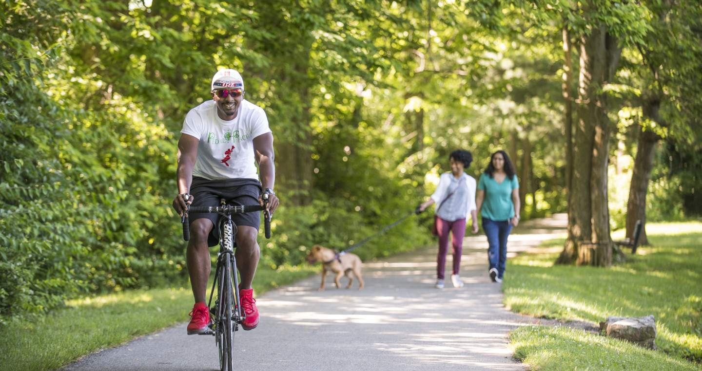 People biking and walking along the rail trail