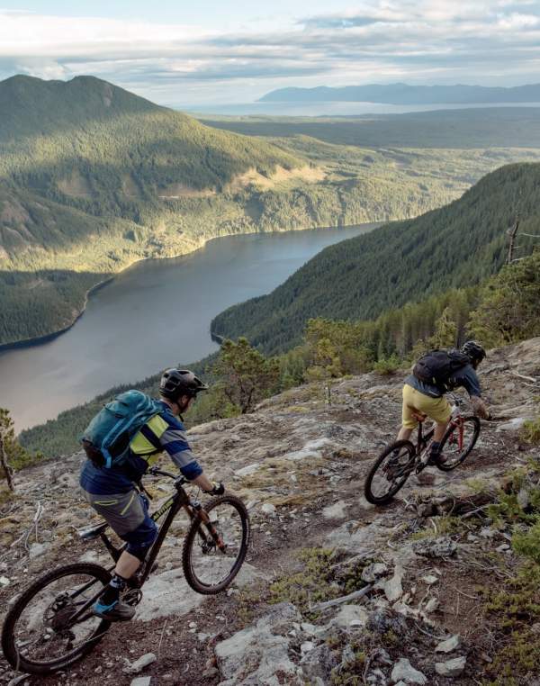 Mountain bikers ride a trail on Mt. Mahony that overlooks Haslam Lake.