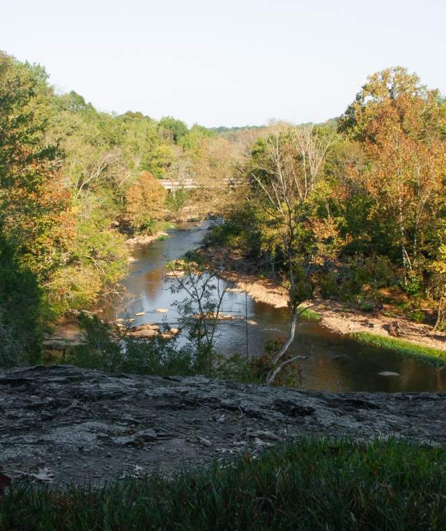 Deep river state trail access water and trees at faith rock