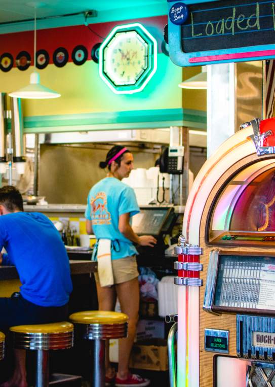 A jukebox plays familiar favorites while visitors enjoy a delicious meal at the Hub City Diner