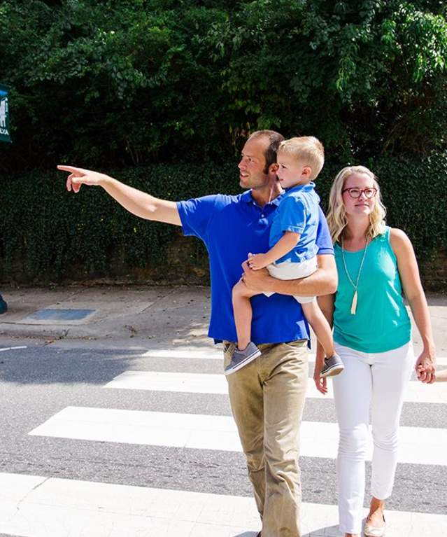 family crossing the street
