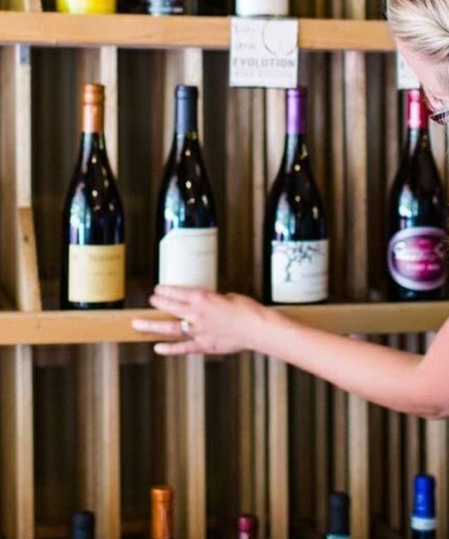 Woman browsing wine rack