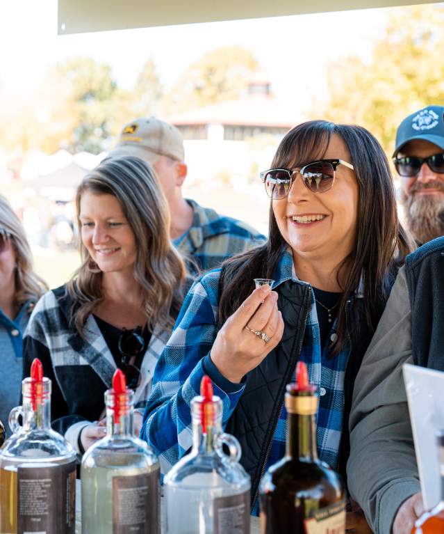 Four Bonfires, Barrels & Brews attendees tasting wines at Pour Tour signature fall festival