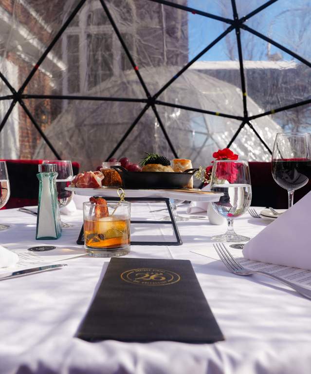 A table set for igloo dining at The Queensbury Hotel