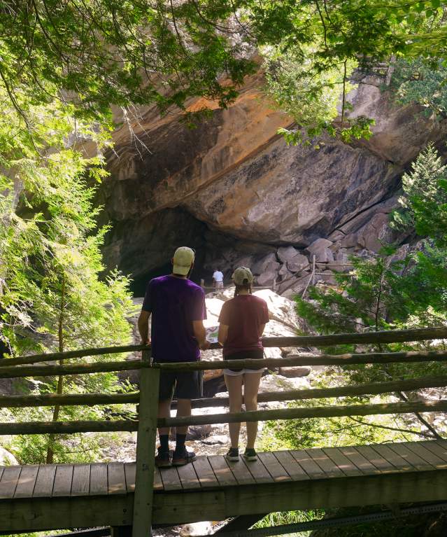 Couple standing on a bridge at Natural Stone Bridge and Caves
